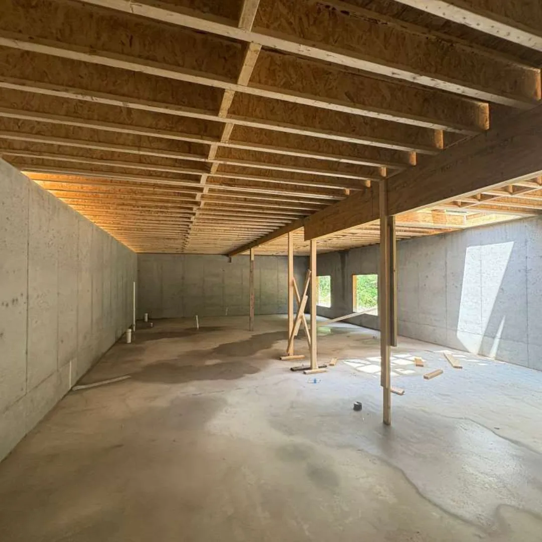 Basement framing and concrete foundation walls.