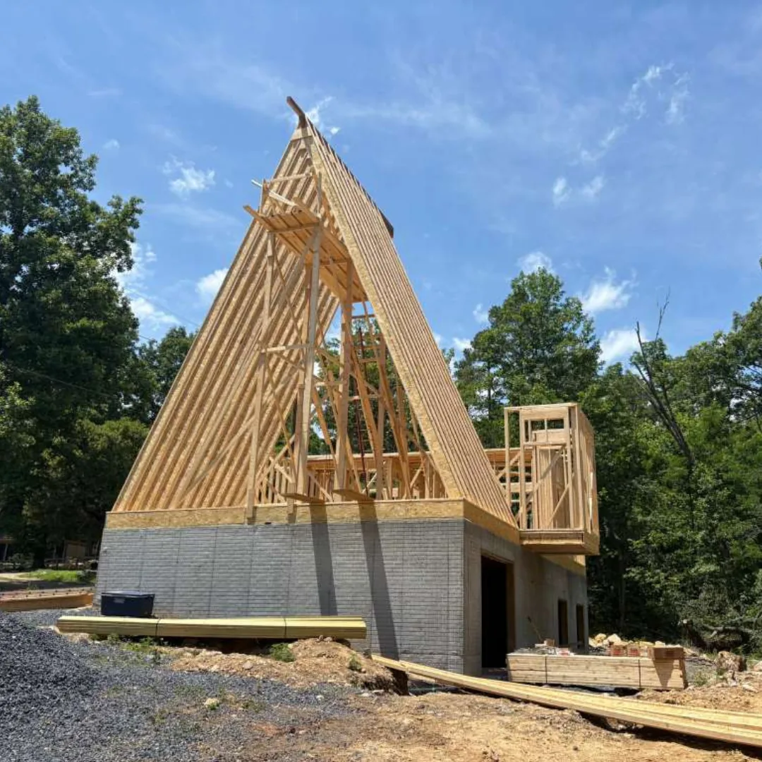 A-frame house construction with exposed framing.