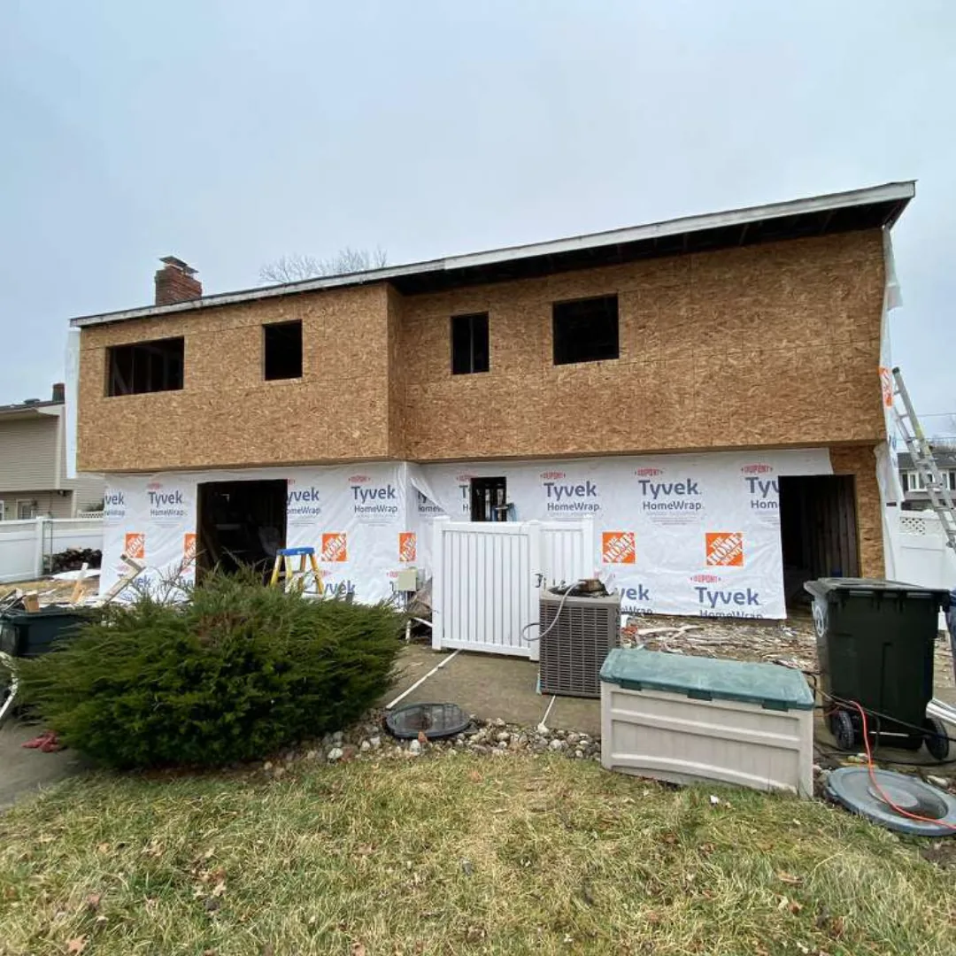 House under construction with exposed wood sheathing