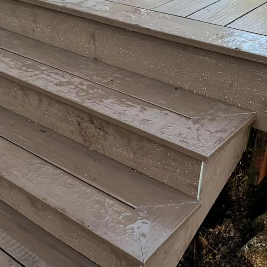 Wet composite deck stairs after rainfall
