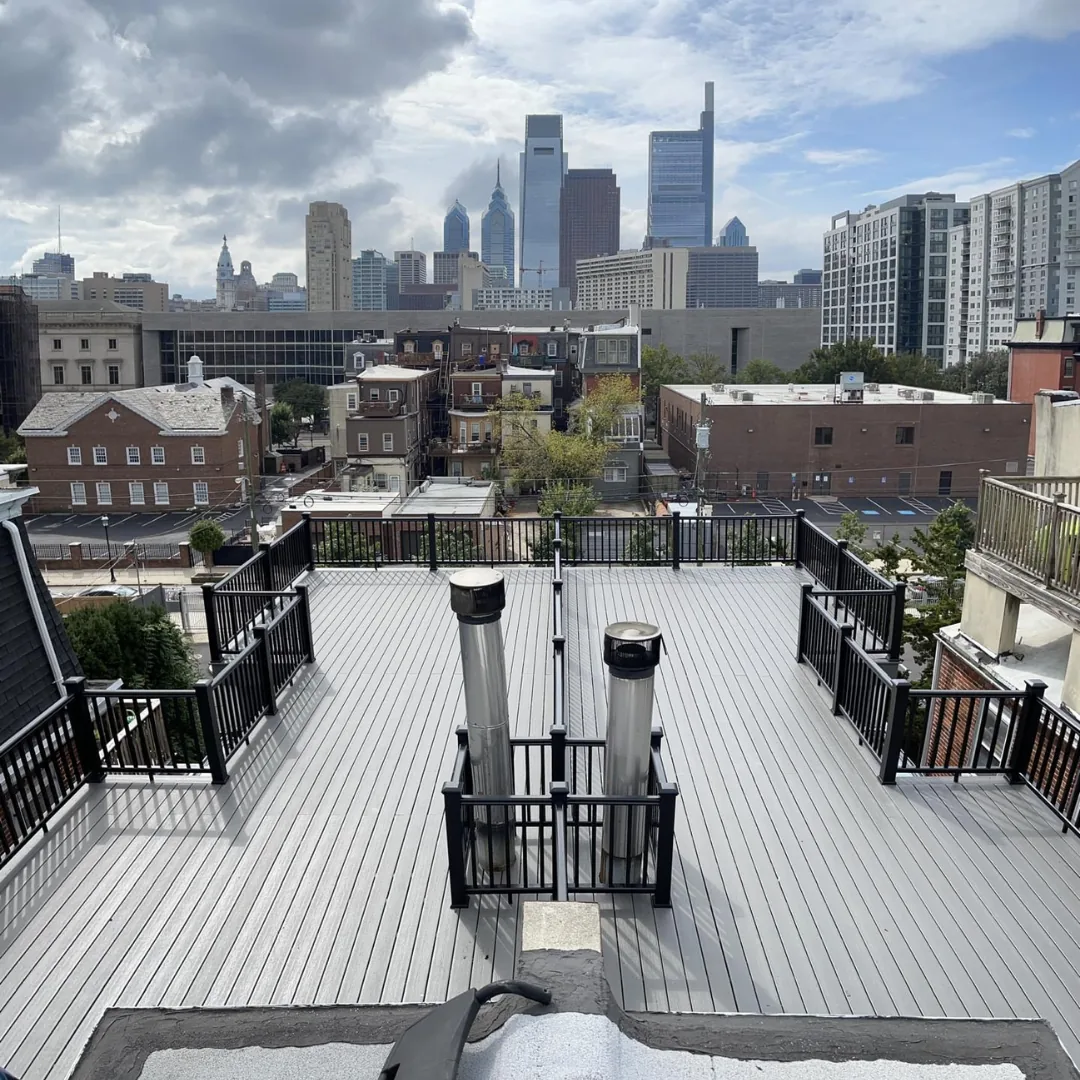 Rooftop deck with city skyline view.