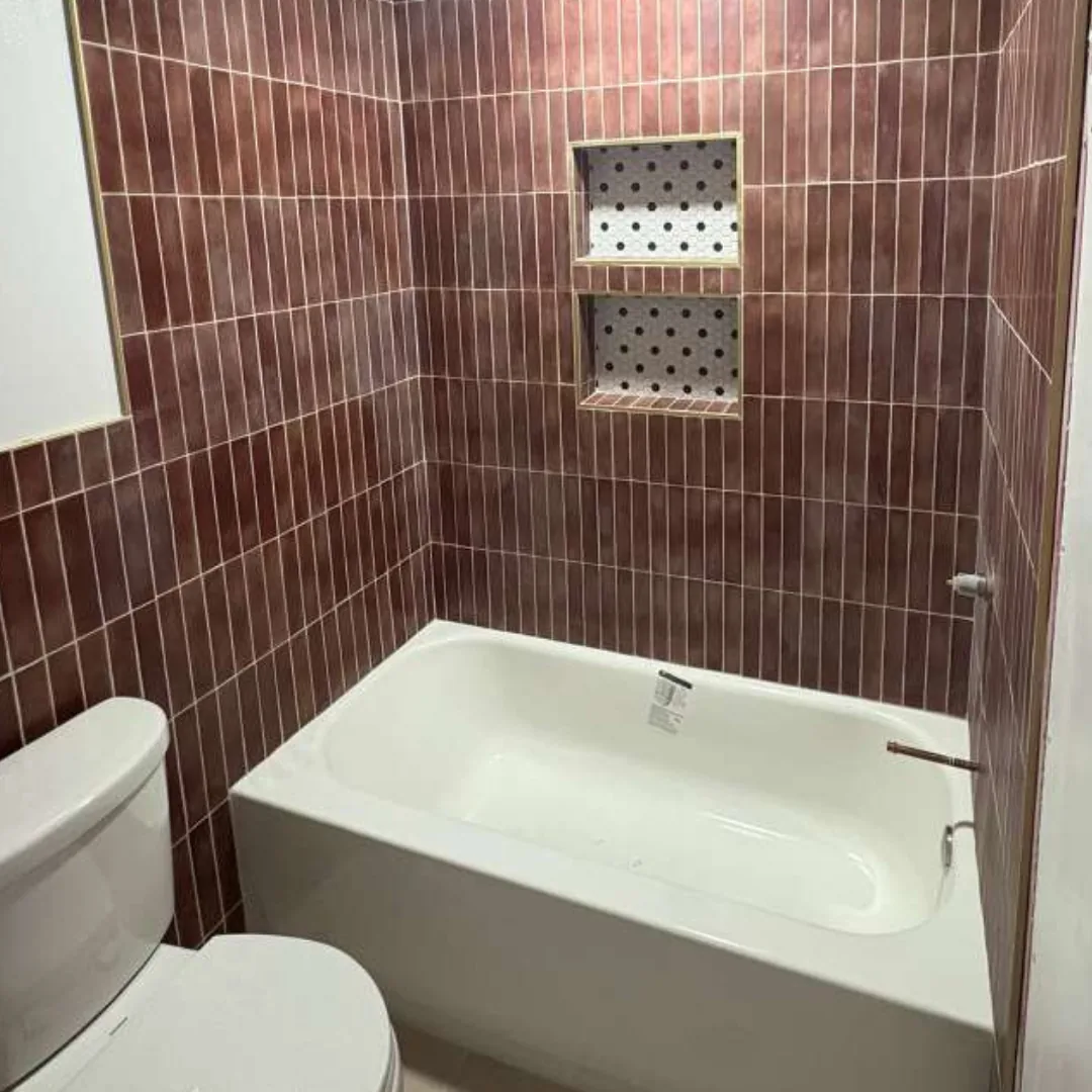 Bathroom with new tiles and bathtub.
