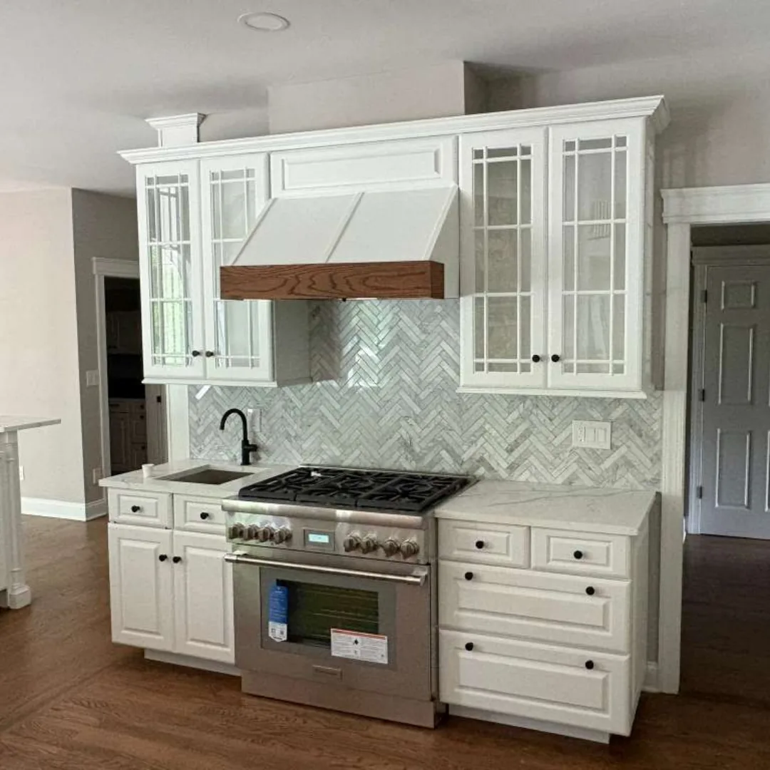 Modern kitchen with white cabinets and backsplash